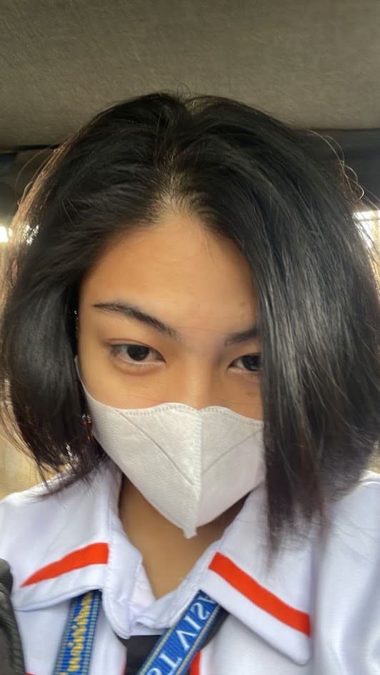 April wearing a face mask on her way to work